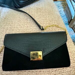 Black vegan leather and suede clutch and cross body bag.